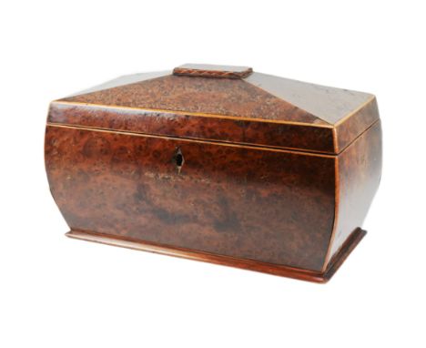 A 19th century amboyna and burr yew-wood two-sectioned sarcophagus shaped tea caddy. Hinged lid opens to reveal two tea boxes