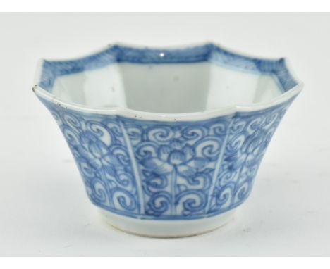A small Qing dynasty possibly Kangxi period porcelain octagonal tea cup. The cup depicts lotus and foliage throughout. to ext