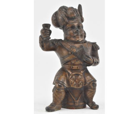 A cast bronze matchstick holder in the form of a figured knight. The knight with plumed helmet, hinges at the neck &amp; hold