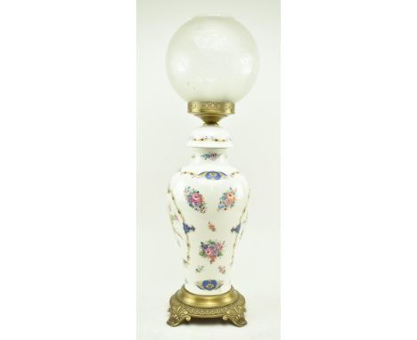 A vintage tin / metal French style enamelled vase lamp. The lamp having a baluster body painted in magnolia white base with f
