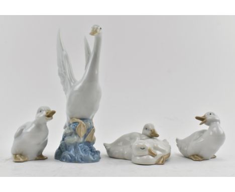 Nao Porcelain - four late 20th century fine bone china figurines of birds. The lot comprising a swan taking off named Ready t