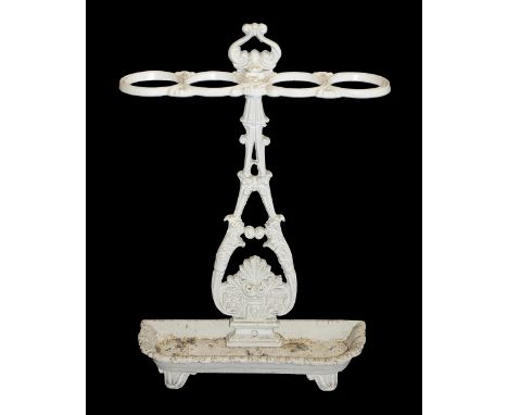 A Victorian cast iron hall stick/umbrella stand c.1880painted white, decorative stand with pierced back plate with floral mot