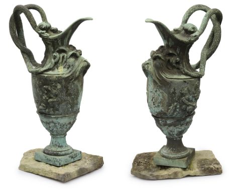A pair of ornamental verdigris bronze ewers after the antiquelate 19th / early 20th centurycast with goats masks, classical f
