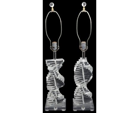 A pair of 1970s lucite table lampsof helix design, formed of stacked slabs, on square bases, (2)height 77cm.,Condition: Good 