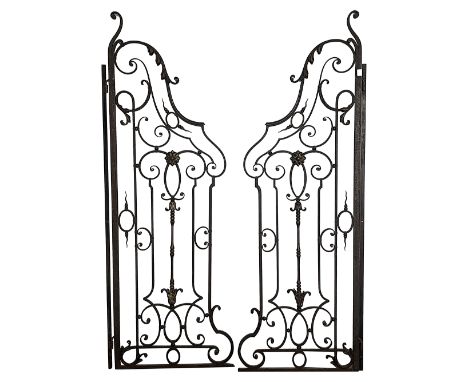 A pair of wrought iron garden gates, black painted, of scrollwork design, with gilt acanthus leaf. flamiform finial and flowe