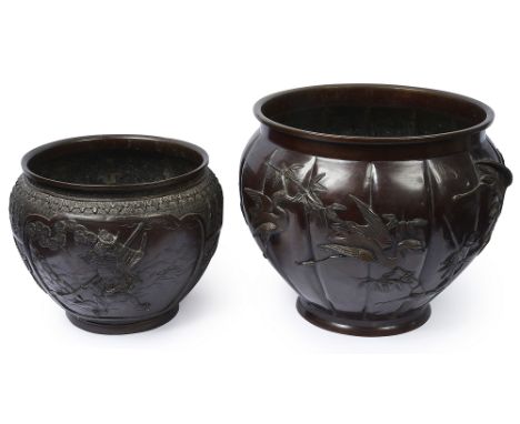 Two Japanese Meiji period patinated bronze jardinieresthe larger, of lobed form decorated in relief with cranes in flight and