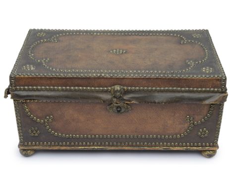 A small Regency leather and brass studded trunkwith twin gilt brass lion mask ring handles to sides,  interior lined in marbl