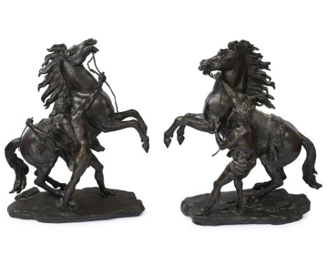After Guillaume Coustou, (1677- 1746)A large pair of late 19th patinated bronze Marly horses, each modelled as a rearing stal
