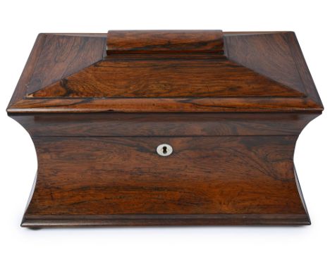 A William IV rosewood sarcophagus form tea caddywith curved sides, the fitted interior with central associated crackle glass 