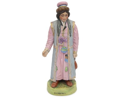 A Gardner bisque porcelain figure of a woman from Kalmykia, from the 'People of Russia' series, Dmitrovskaya factory, Kuznets