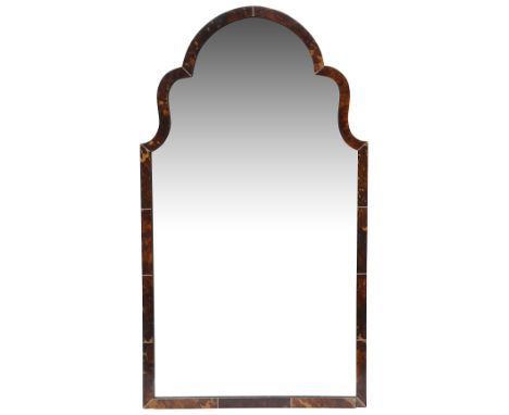 An early 20th century tortoiseshell and ivory dressing table mirror rectangular with shaped top, the frame tortoiseshell vene