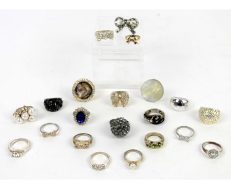 Twenty costume rings, including bow motifs and a snake ring, all in base metal set with cz and enamel detailing, ring sizes L