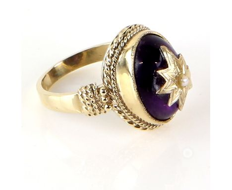A gold ring set with cabochon amethyst  overlaid with pearl set gold star, 9 ct, ring size K 1/2  .    CONDITION9 ct gross we