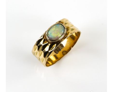 Vintage ring, centrally set with oval cabochon cut opal, 7 x 5mm, rub-over set on faceted band, ring size Q, stamped 18 ct . 