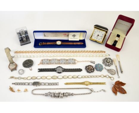  A group of costume jewellery, including brooches, faux pearl necklace, vintage Equity travel clock, ladies quartz watches  a