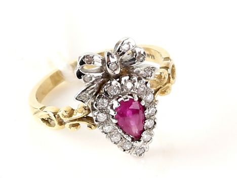 Gold heart and bow ring, set with a ruby and diamonds, in white and yellow gold, 9 ct, ring size N .    CONDITION9 ct gross w