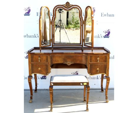 Modern mahogany dressing table with gilt highlighted decoration, with stool and mirror,.    