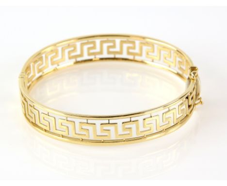 Greek key open work bangle, concealed clasp and two figure of eight safety catches, stamped 18 ct .    CONDITION18 ct gross w