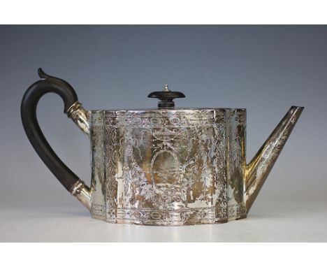 A George III style silver teapot, W & G Sissons, London 1910, the straight sided oval  teapot with overall garland and foliat