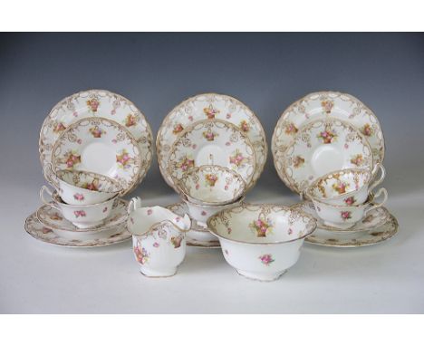 A Royal Doulton tea service, each piece decorated with baskets of flowers, comprising; six cups, six saucers, six side plates