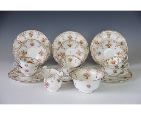 A Royal Doulton tea service, each piece decorated with baskets of flowers, comprising; six cups, six saucers, six side plates