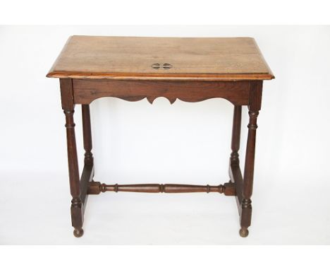 A light oak Ecclesiastical side table, with carved detailing, on turned and block legs, 78cm H x 86cm W x 55cm D