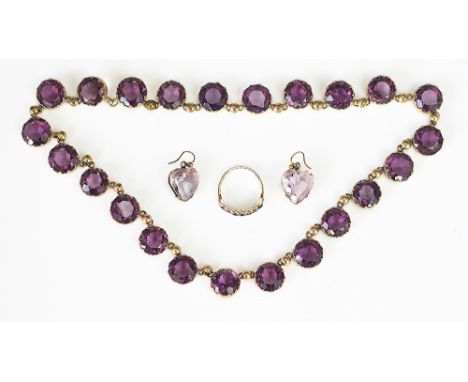 An assembled suite of amethyst coloured jewellery, to include; an amethyst seven stone ring AC Co, set in 9ct gold, a pair of