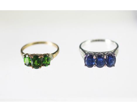 A Russian diopside and diamond set 9k yellow gold ring, the three green stones with diamond set shoulders, along with a simil