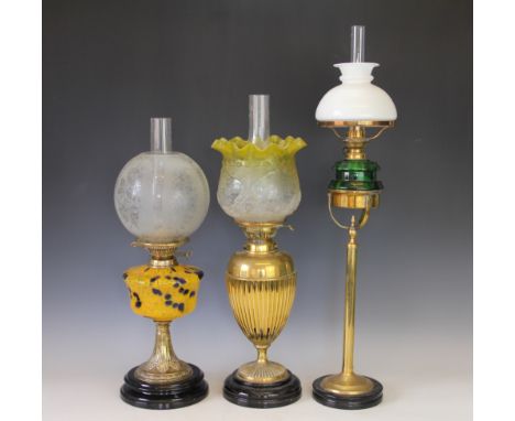 A Victorian oil lamp with attractive cobalt and orange mottled glass reservoir, etched glass shade and clear chimney, 58cm hi