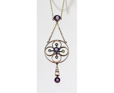 An Edwardian amethyst set pendant and chain, the circular pendant with amethyst and seed pearl detail, suspending an amethyst