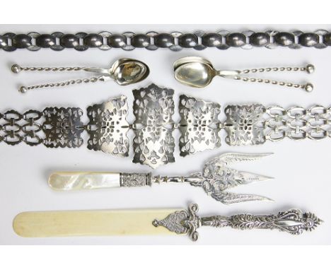 A selection of silver and plated wares, to include; a Victorian page turner, two belts, four spoons with twisted stems, a toa