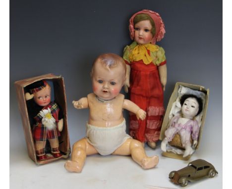 A selection of toys, to include; an Armand Marseilles dolls head on cloth body, head marked '390 5/0 AM' 37cm long, a further