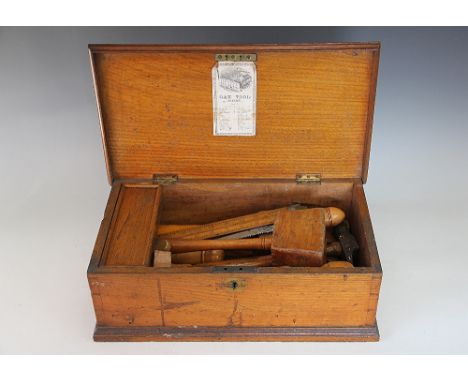 An Edwardian golden oak 'Oak Tool Chest No. 5', the rectangular chest with hinged lid enclosing various tools and key box to 