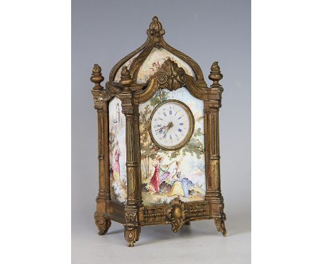 A late 19th century brass and enamel mantel time piece, the top, front and sides inset with Viennese enamel panels decorated 