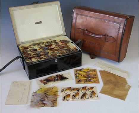 A vintage fly reservoir by C Farlow and Co Ltd, c1910, the tan leather outer case with leather handle and brass clasp, stampe