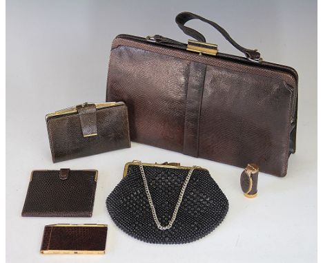 A collection of lady's textiles and accessories, to include an animal skin hand bag retailed by Mappin and Webb, three purses