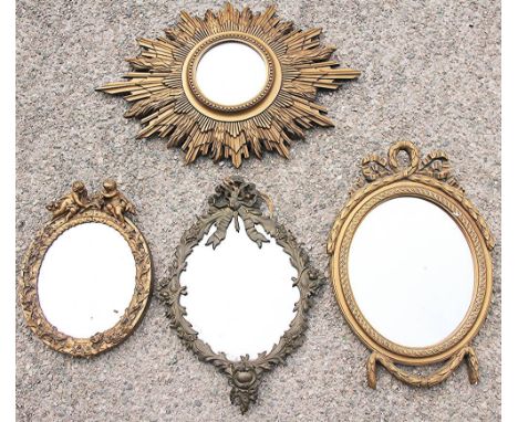 Three gilt gesso / composition mirrors, including an oval bow tied example, 46cm, with a gilt brass wall mirror, lacking gira