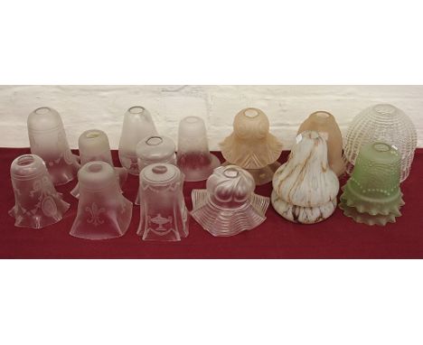 A collection of assorted lamp shades, to include; etched, frosted and moulded glass shades in green, peach and colourless, al