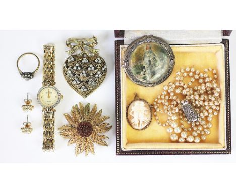 A selection of jewellery to include; a paste set cluster ring set in '9ct & Sil', a cameo brooch, a Pierre Cardin wristwatch 