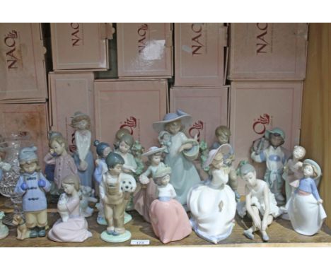 18 Nao figures of differing sizes, with original boxes. Also includes a pair of cut glass lamp style vases  No evidence of da