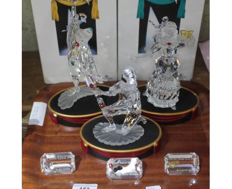 Three Swarovski crystal figures: Harlequin, Columbine and Pierrot, with original boxes, plaques and stand  Fingertips missing
