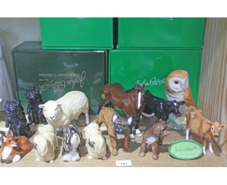 13 animal figure by John Beswick, with original boxes, including 7 dogs, 2 cows, a horse, an owl, a fox and a sheep. The lot 