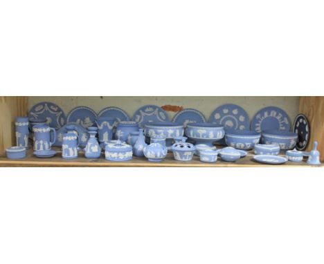 A large collection of Wedgwood blue Jasperware, approx. 41 pieces including candlesticks, pedestal bowls, clock, jugs, vases,