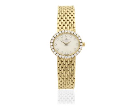 Baume &amp; Mercier. A lady's 18K gold diamond set quartz bracelet watch with mother of pearl dialReference: 18310 9Date: Cir