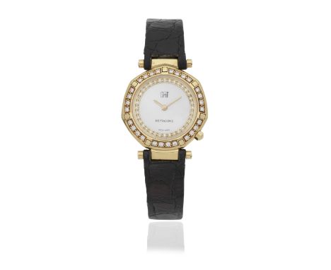 GMT. A lady's 18K gold diamond set quartz wristwatch with mother of pearl dialModel: HeptagoneReference: 5447Date: Circa 1990