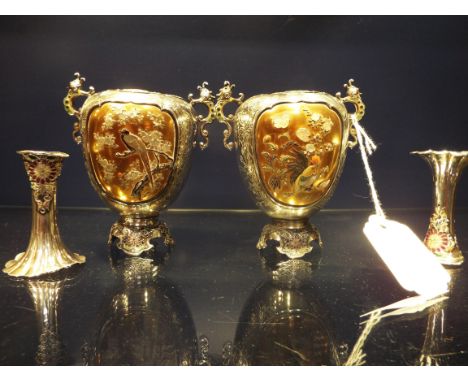 A pair of Japanese twin handled white metal vases having Shibayama panels of bird and floral scenes and enamel floral decorat