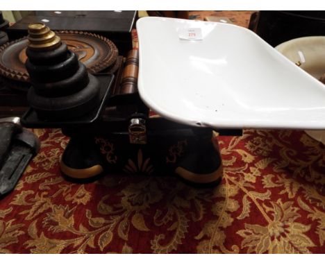 A set of vintage hand painted cast iron kitchen scales and weights