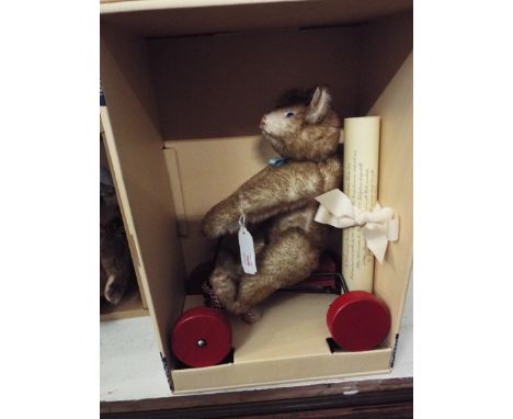 A boxed Steiff Record Petsy 1928 mohair bear seated on his car fitted with a squeaker, button to ear complete with certificat