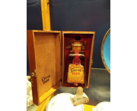 A vintage 1940s bottle of Cuervo 1800 tequila, in original box