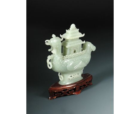 A 1920's nephrite jade boat and pagoda cover, the pale grey green stone carved as a mandarin duck with loose ring handles eit